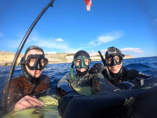 Freediver in a wetsuit training at a buoy